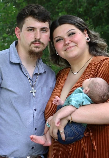 Family of husband, wife, and baby